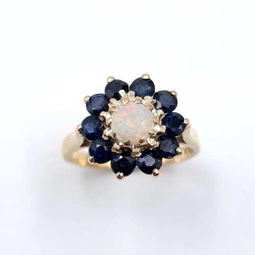 43 - Star Lot : An attractive antique opal and sapphire cluster ring. Size - M. Weight - 3 grams.