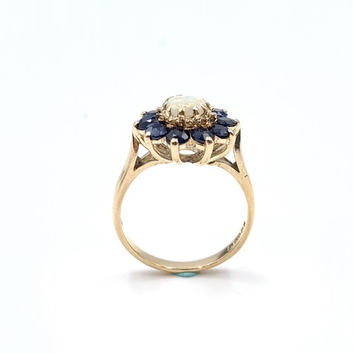 43 - Star Lot : An attractive antique opal and sapphire cluster ring. Size - M. Weight - 3 grams.