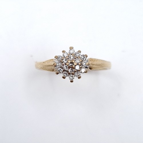 502 - Star Lot : A nine carat gold diamond cluster ring. Est. weight of diamonds - 0.3 carats. Size - M. W... 