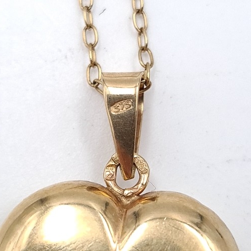 528 - Star Lot : A nine carat gold heart shaped pendant & chain (375 stamped to pendant). Length of chain ... 