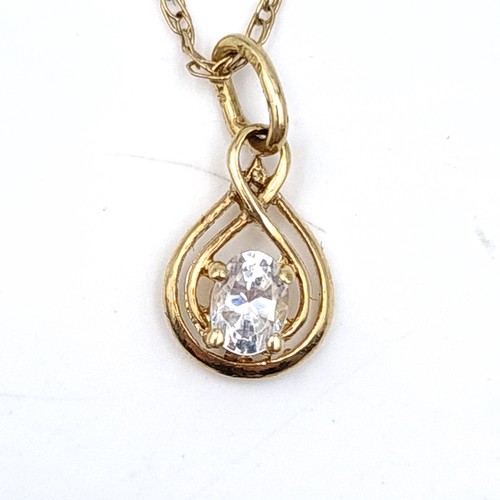 539 - A 9ct gold gem set pendant necklace. Length - 52 cms. Boxed. Stamped 375 to clasp.