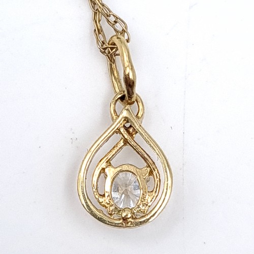 539 - A 9ct gold gem set pendant necklace. Length - 52 cms. Boxed. Stamped 375 to clasp.