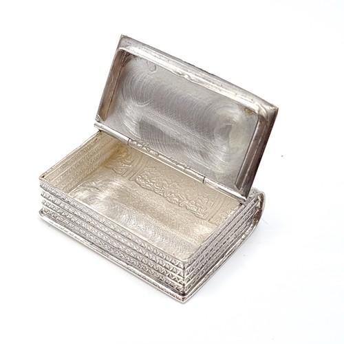 559 - A very pretty sterling silver assayed ring/pill box with hinged lid modelled as a book. Dimensions: ... 