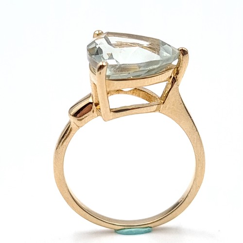 561 - A gold plated aquamarine stone ring in the form of a hart stamped 925. Size - O. Weight - 3.85 grams... 