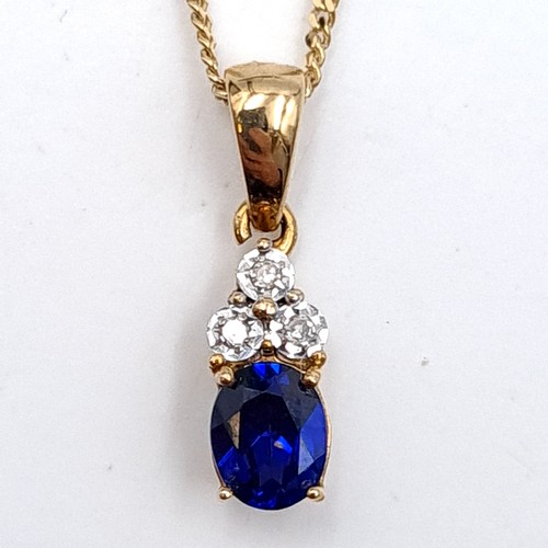 595 - Star Lot : A beautiful nine carat gold sapphire & diamond pendant necklace. Length of chain - 44 cms... 