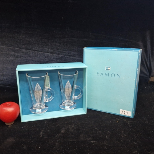 133 - A pair of Eamon Cafe glass mugs with attractive leaf print design and original presentation box.