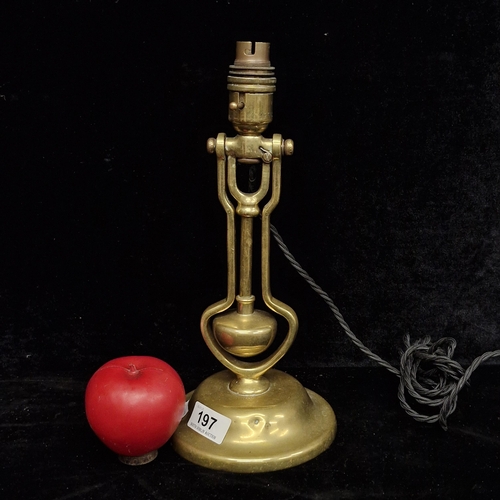 197 - A superb antique solid brass gimbal table lamp. Circa 1930s with a silk cord may have been in a firs... 