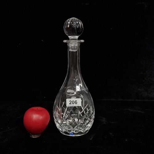 206 - A quality Cavan Crystal decanter with original stopper. In good condition with acid mark.