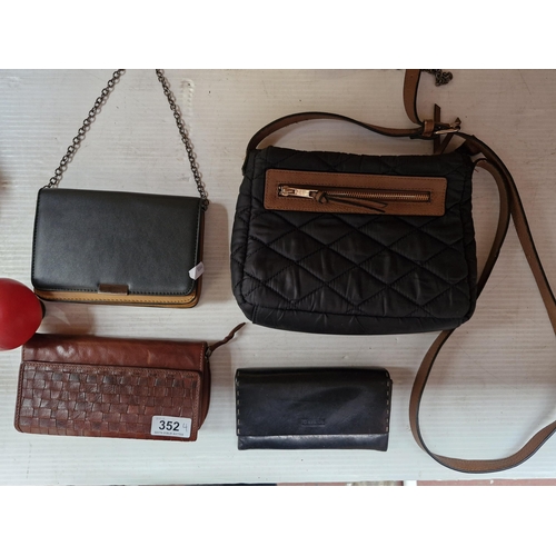 352 - Two lovely leather wallets. Along with a 'New Look' and 'M&S collection' sling bag.