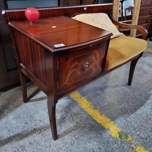 462 - A good quality vintage chippy telephone gossip seat with storage space.