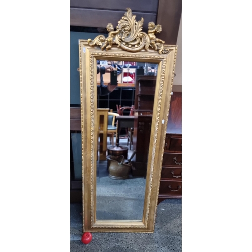 463 - Star Lot : A large contemporary bevelled wall mirror housed in a gilt wood fame of neo classical des... 