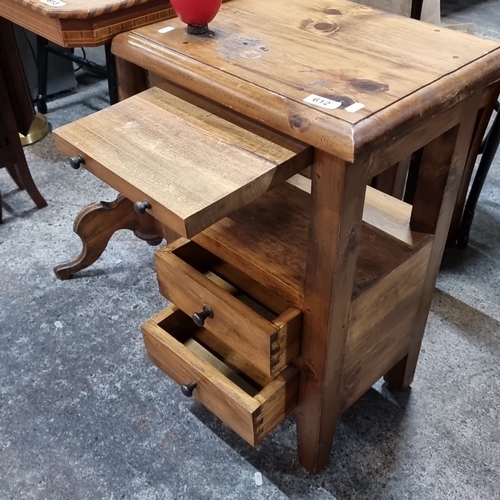 612 - A rustic wooden side table with two lower drawers, one slide-out tray, and open shelving. Features a... 