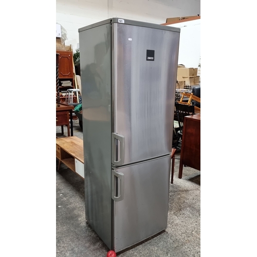 621 - Star Lot : A Zanussi free stranding fridge freezer in a brushed stainless steel finish. Model ZRB384... 