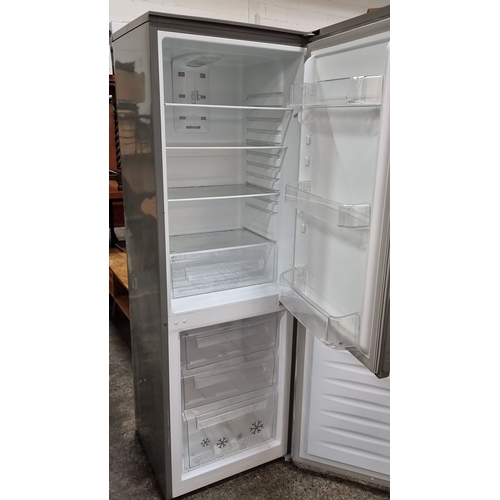 621 - Star Lot : A Zanussi free stranding fridge freezer in a brushed stainless steel finish. Model ZRB384... 