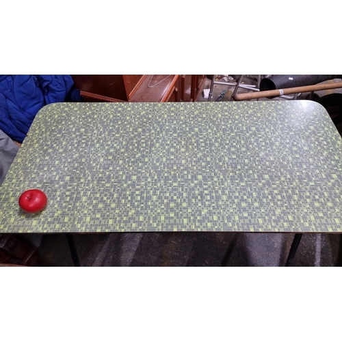 627 - A classic mid century  Formica laminate kitchen table.  Features a green geometric pattern top and b... 