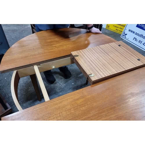 629 - Star Lot : A fab Mid Century extendable Teak Dining Table from the 1960s. Circular design with a cen... 