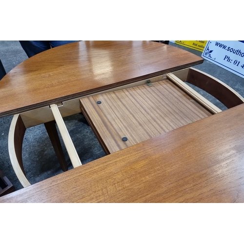 629 - Star Lot : A fab Mid Century extendable Teak Dining Table from the 1960s. Circular design with a cen... 