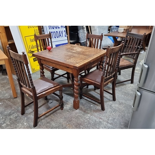 630 - A very handsome antique, early 20th-century oak dining set. Comprising of a barley-twist leg extendi... 