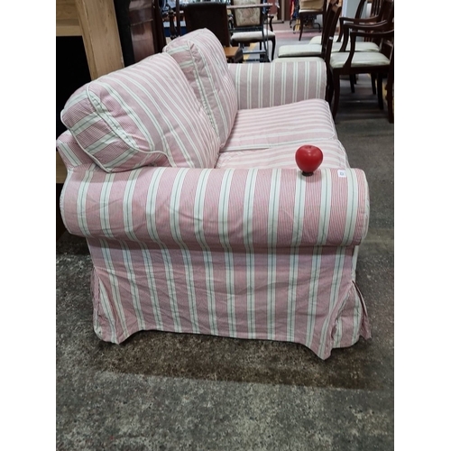 631 - A gorgeous candy striped two-seater sofa with removable covers. A well made sofa in good condition. ... 