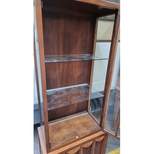 632 - A lovely art deco display cabinet featuring glass doors, shelves, and wonderful scalloped accents. C... 