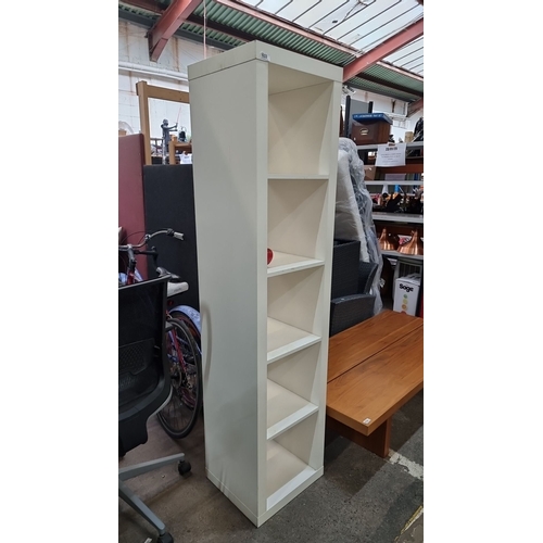 633 - A tall, contemporary white freestanding shelving unit with five adjustable shelves. Constructed from... 