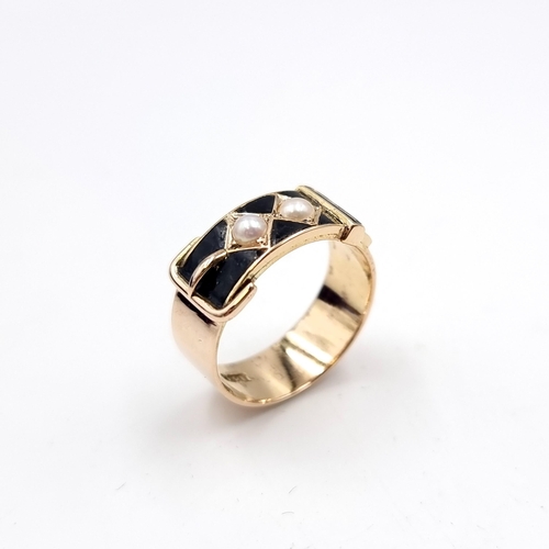 10 - Star Lot : A very good example of an antique 18 carat gold onyx and pearl buckle ring. Ring size - O... 