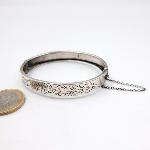 20 - A hallmarked silver bracelet with foliette detailing & safety chain. Weight - 9.7 grams.