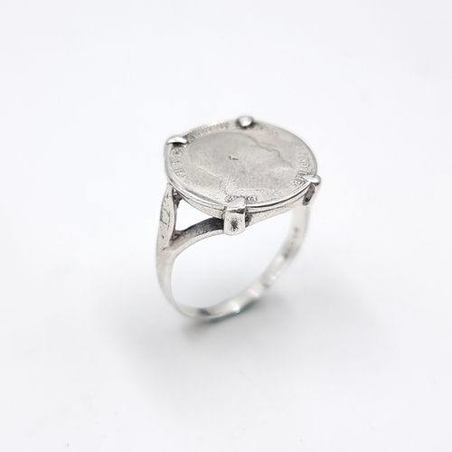 21 - A silver ring set with a silver Edwardian coin mount dated 1906. Size - P. Weight - 3.56 grams.