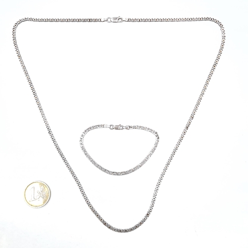 36 - A sterling silver chain link necklace. Length - 60 cms. Together with a sterling silver bracelet. To... 