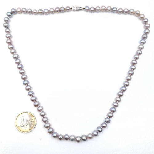 38 - A good quality cultured pearl necklace set with sterling silver clasp. Length - 48 cms.