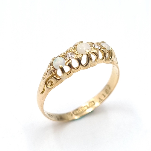 49 - Star lot : A very pretty 18 carat gold opal & diamond ring hallmarked Birmingham 1912. Size - P 1/2.... 