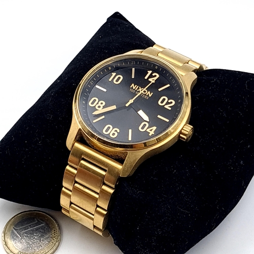 513 - A Nixon Argento wristwatch (Water resistant up to 100 metres) Watch comes in presentation box.