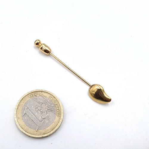 517 - A nine carat gold brooch/tie pin. Weight - 2.7 grams. Boxed.