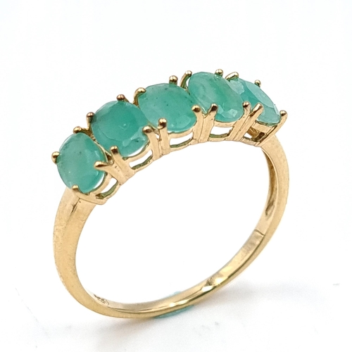 58 - Star Lot : A five stone emerald silver gilt ring. Size - R. Weight - 1.81 grams.