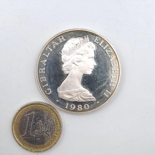 580 - A UK Queen Elizabeth solid silver crown dated Gibraltar - 1980. Weight - 28.14 grams.