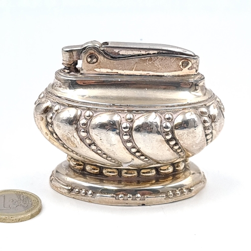 649 - A nice example of a vintage silver plated Ronson crown table lighter.