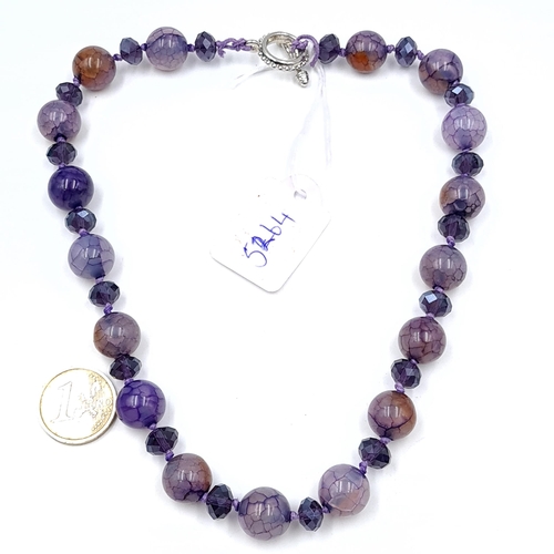 662 - An amethyst Murano glass bead necklace. Length - 42 cms. Weight - 80 grams.