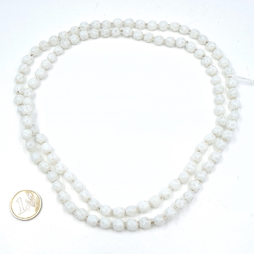 665 - An unusual white coral bead necklace. Length - 100 cms. Weight - 90 grams.