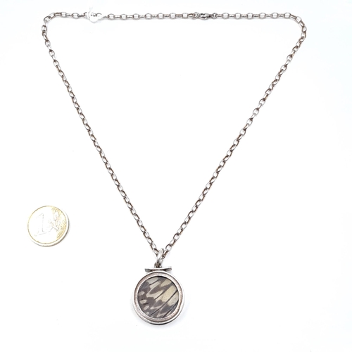 670 - A sterling silver locket with inlaid quartz stone. Length of necklace - 48 cms. Weight - 21 grams.