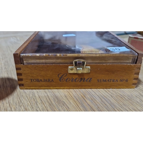 830 - A Vintage Tobajara Corona Sumatra No. 6 wooden cigar box features dovetail joints, a glass lid, and ... 