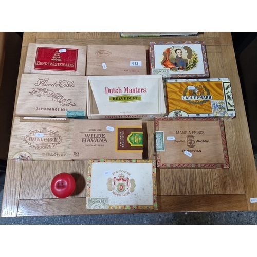 832 - A selection of vintage cigar boxes. Features designs from Dutch Masters, Henri Wintermans, and Punch... 