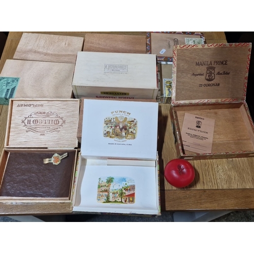 832 - A selection of vintage cigar boxes. Features designs from Dutch Masters, Henri Wintermans, and Punch... 