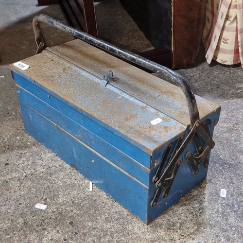 836 - A vintage blue metal cantilever toolbox filled with assorted tools and hardware.