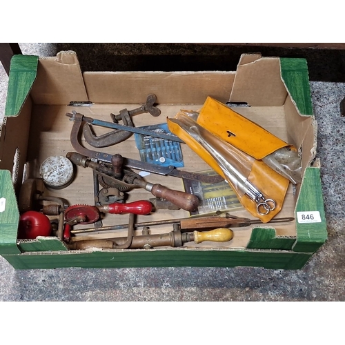 846 - A crate containing an array of miscellaneous tools. Features hand drills, clamps, woodworking tools,... 