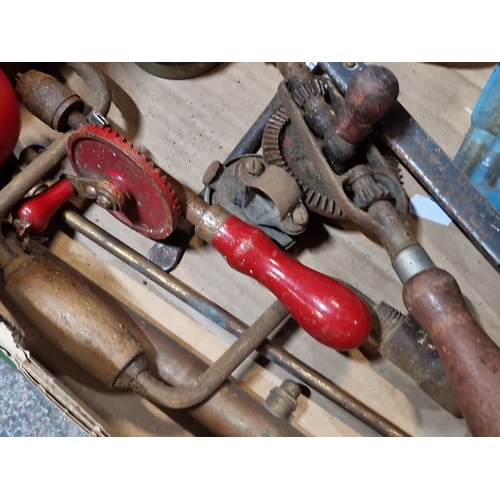 846 - A crate containing an array of miscellaneous tools. Features hand drills, clamps, woodworking tools,... 