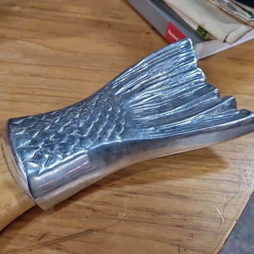 852 - A Fish-shaped carving board with a wooden base and detailed silver-plated head and tail accents.