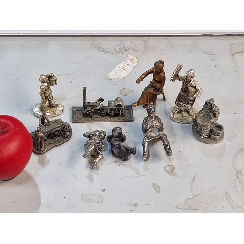 864 - Nine cast pewter miniature figures including examples by Royal Hampshire.