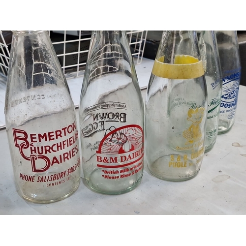 865 - Vintage Irish milk bottles featuring various dairy logos, including Emerton Murchfield, Home Farm, P... 