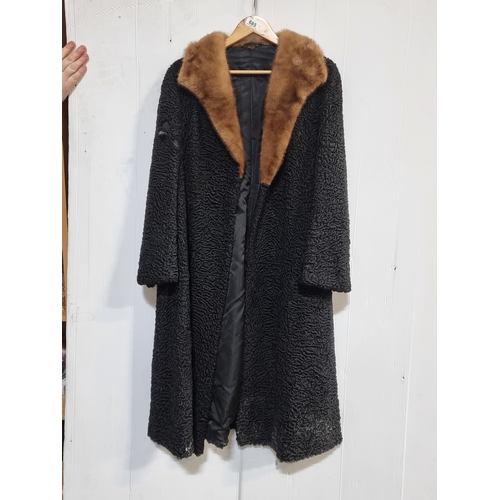 685 - A lovely vintage black Coat with fur trim to collar. Some minor tear to right hand.