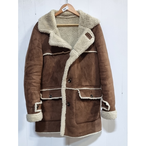 690 - A Brown shearling-style coat with faux fur lining. Size M.